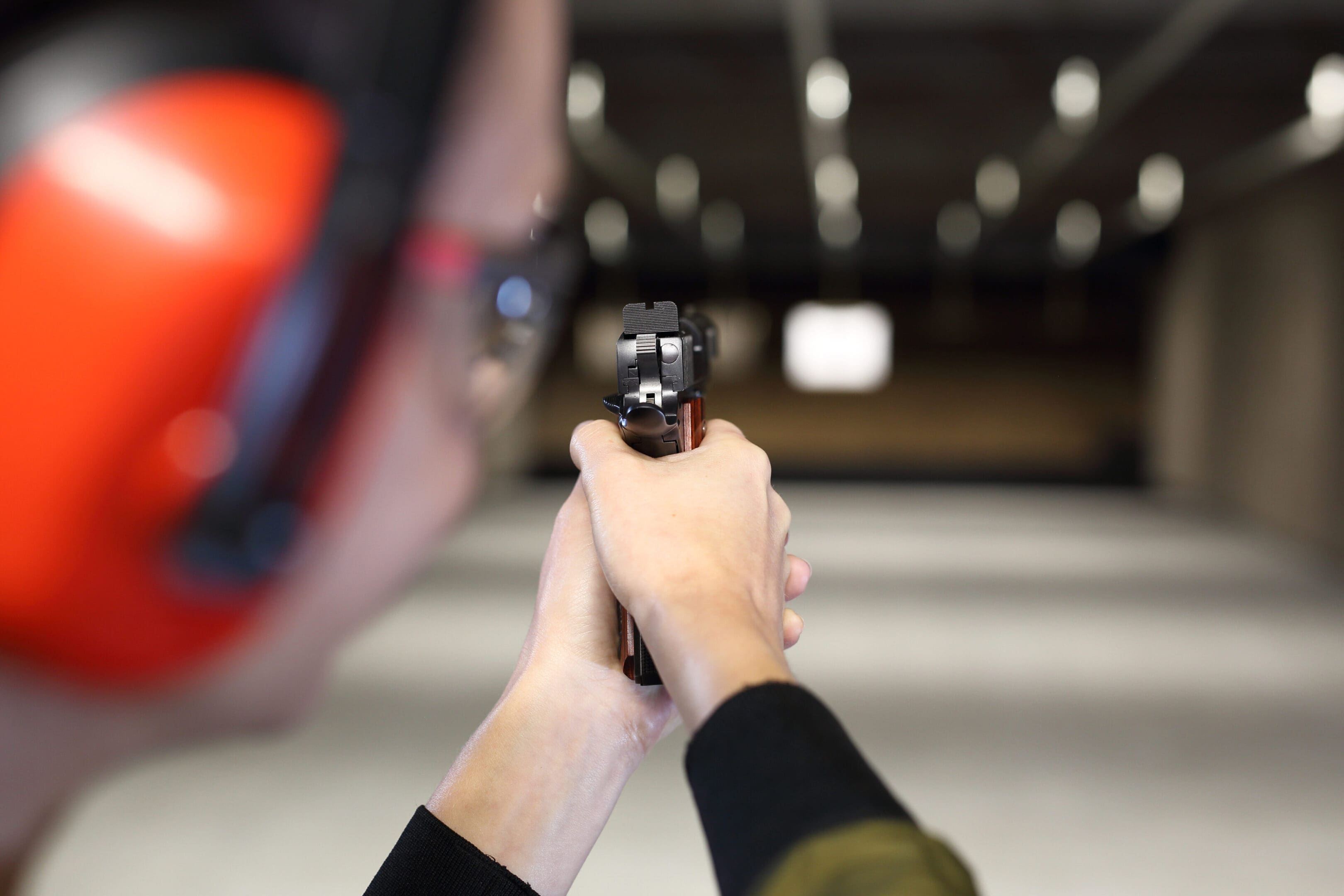 Measuring to a paper target on the shooting range.