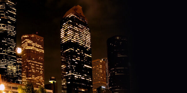 banner Houston skyline at night.
